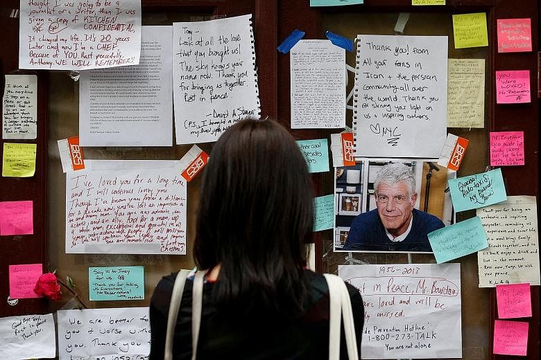 Tributes to Mr Anthony Bourdain outside Brasserie Les Halles in New York on June 11. The chef and television personality was found dead on June 8 in a hotel bathroom in Kaysersberg, a small village in the Alsace region of France, where he had been fi