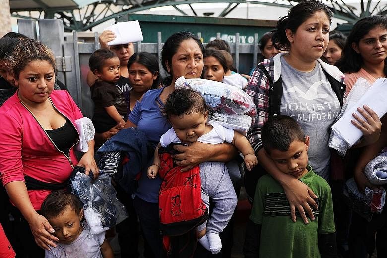 Migrants from Central America arriving at a bus station following their release from detention in Texas on Friday, two days after President Donald Trump signed an executive order that stops the practice of separating families seeking asylum. Once the