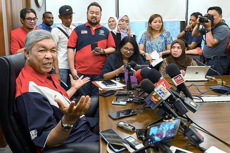 Umno's acting president Ahmad Zahid Hamidi at a press conference in Putra World Trade Centre. He has agreed to a televised debate on Friday against his two main rivals for the post of party president.