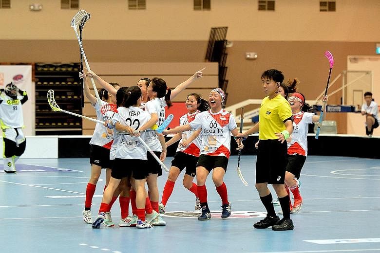 The Singapore team celebrating after beating Thailand 4-1 in the final of the Women's Asia-Oceania Floorball Confederation Cup.