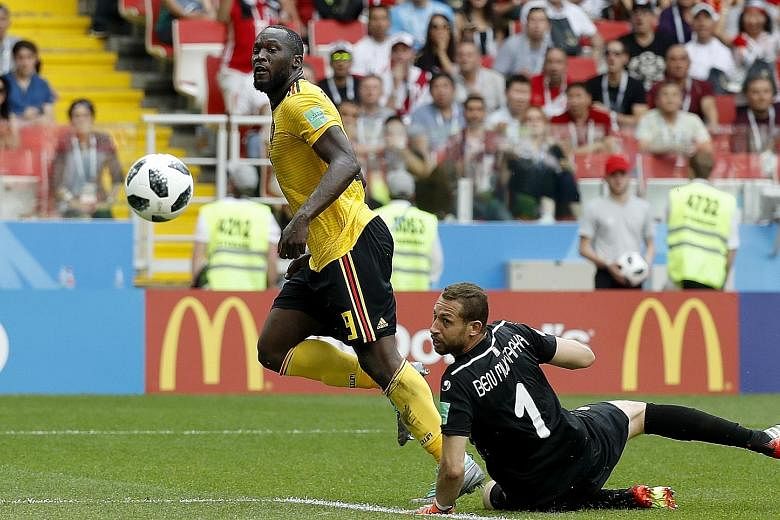 Romelu Lukaku scoring his second goal past Tunisia goalkeeper Farouk Ben Mustapha to give Belgium a 3-1 lead in their World Cup 2018 Group G match in Moscow yesterday.