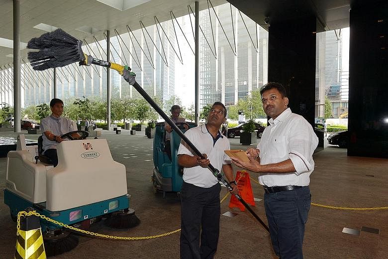Cleaning Express chief executive Abdul Aziz Yusof (left photo, right) says while he tries to maintain his workers' salaries at a higher level, it can be tough when competitors bid for contracts at lower prices. Prosegur Singapore director Robert Wien