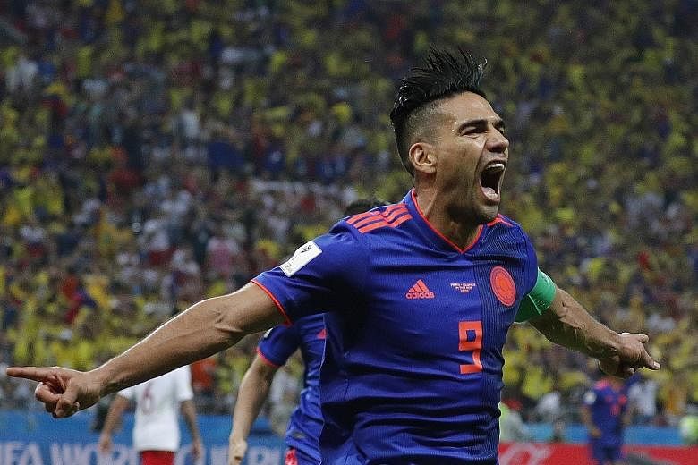 Radamel Falcao of Colombia celebrates after scoring a clinical and hair-raising second goal in the 3-0 win over Poland in Kazan on Sunday. The Colombians now need to beat Senegal in their final Group H game to secure their place in the last 16.