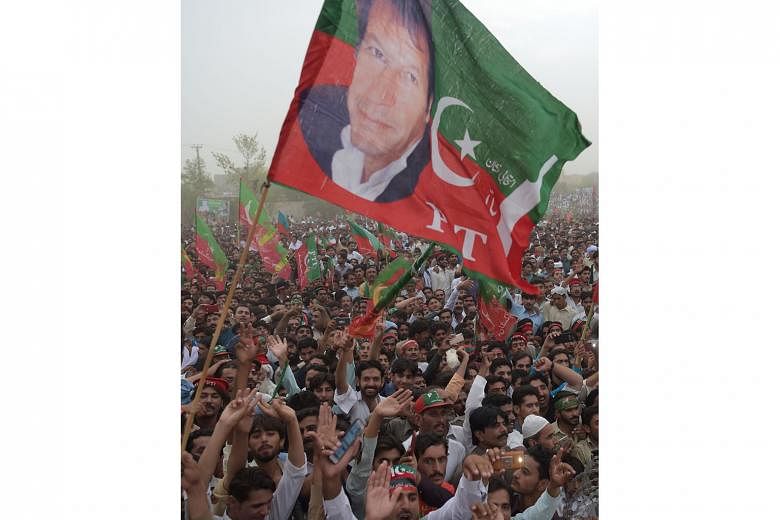 Supporters of Pakistani politician Imran Khan at an election campaign this month. Many believe Mr Khan is in line for elevation to prime minister with the security establishment's support.