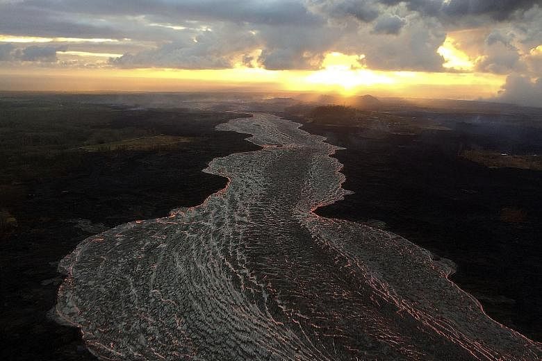 An early-morning view of an open lava channel at Kilauea volcano in Hawaii, seen during a helicopter overflight of the Lower East Rift Zone on Monday, in an image obtained on Tuesday from the United States Geological Survey (USGS). The latest video f