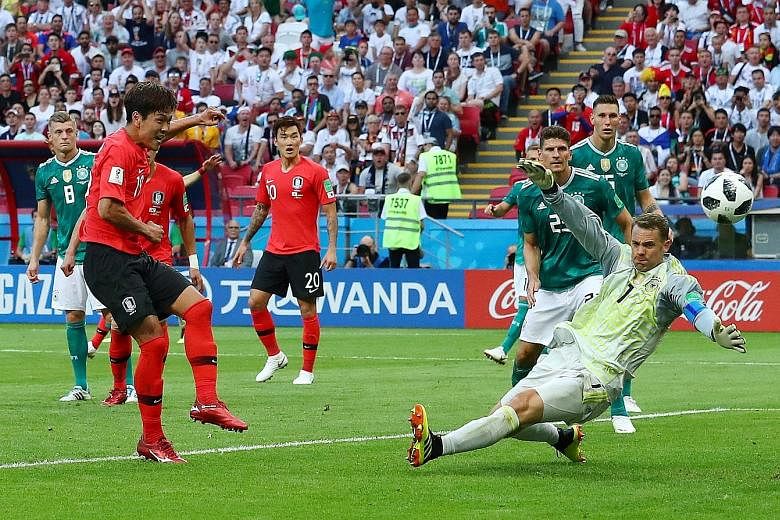 Kim Young-gwon scoring South Korea's first goal past Germany's Manuel Neuer in the 93rd minute. Germany are the third straight reigning champions to go out in the group phase - following Italy and Spain.