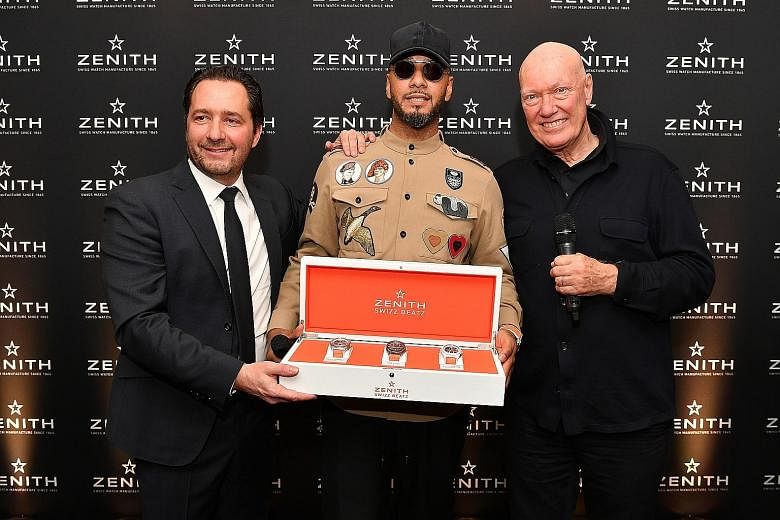 (From far left) Zenith chief executive officer Julien Tornare, Swizz Beatz and Mr Jean-Claude Bivet, head of the watches division at luxury conglomerate LVMH, with the limited-edition Swizz Beatz Defy Zero G and Defy El Primero 21 designed by the rap