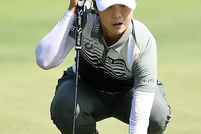 South Korean Park Sung-hyun lining up a putt on the eighth green during Thursday's first round of the Women's PGA Championship at Kemper Lakes Golf Club. She shot a six-under 66 for a one-shot lead.