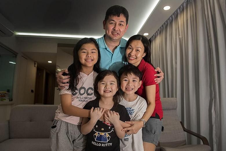 Mr Bryan Lee Ooi Chiang and his wife Lee Ah Nee with their children (from left) Cherise, Celeste and Kayson. Six-year-old Celeste will be joining her older siblings in Chong Fu Primary School in Yishun next year. Mrs Lee says she hopes this will mean