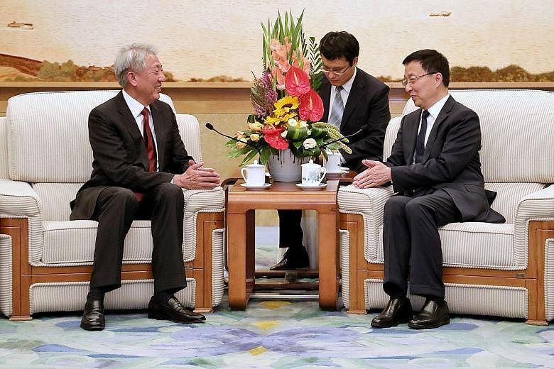 Deputy Prime Minister Teo Chee Hean meets his new Joint Council for Bilateral Cooperation counterpart, Chinese Vice-Premier Han Zheng, at the Great Hall of the People.