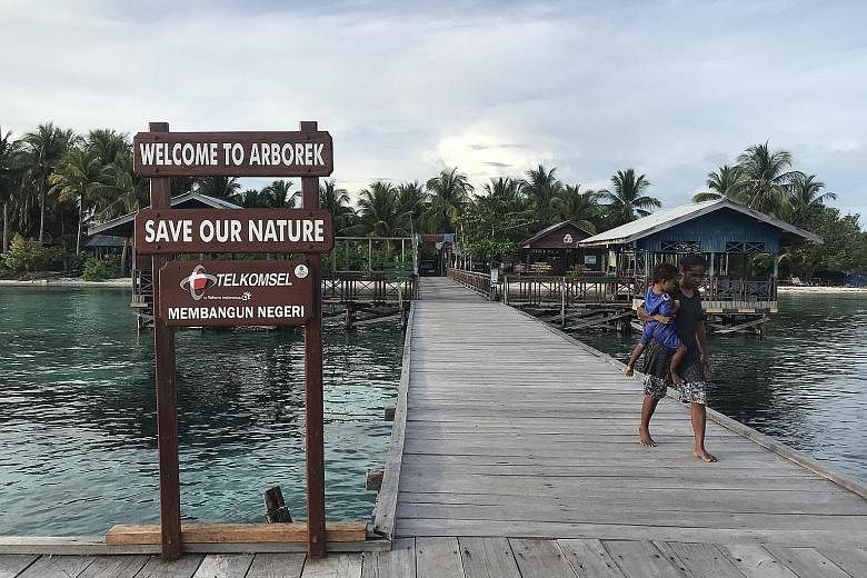 The former shark-fishing village of Arborek now advocates marine conservation, as seen by this sign at the jetty. A traditional Chinese medicine shop in Singapore selling gill rakers of manta rays. There are large numbers of manta rays in the safe wa