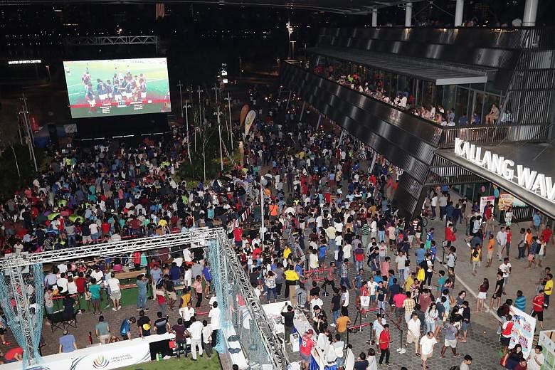 The crowd at the Singapore Sports Hub's Festival of Football last night who turned up to watch the live screening of the France v Argentina match at the OCBC Square outside Kallang Wave Mall.