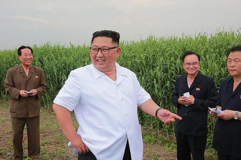 North Korean leader Kim Jong Un inspecting a farm in Sindo county, in an undated picture released by Korean Central News Agency.