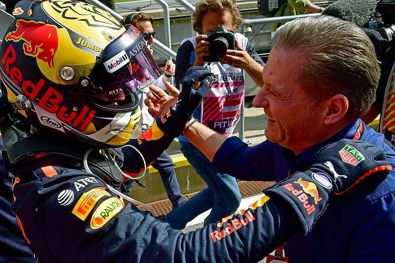 Max Verstappen hugs his father Jos, a former Formula One driver, after his victory in the Austrian Grand Prix yesterday. It was the Dutch driver's first win this year.