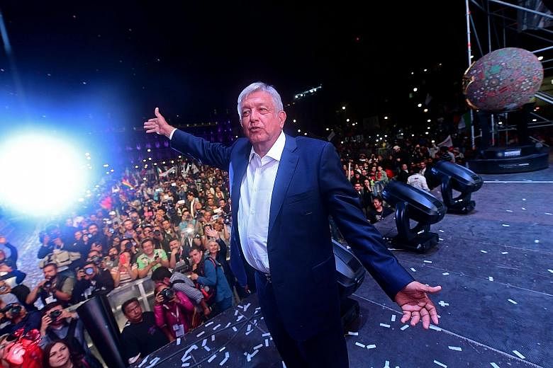Mr Andres Manuel Lopez Obrador with his supporters at Mexico City's Zocalo Square after his victory.