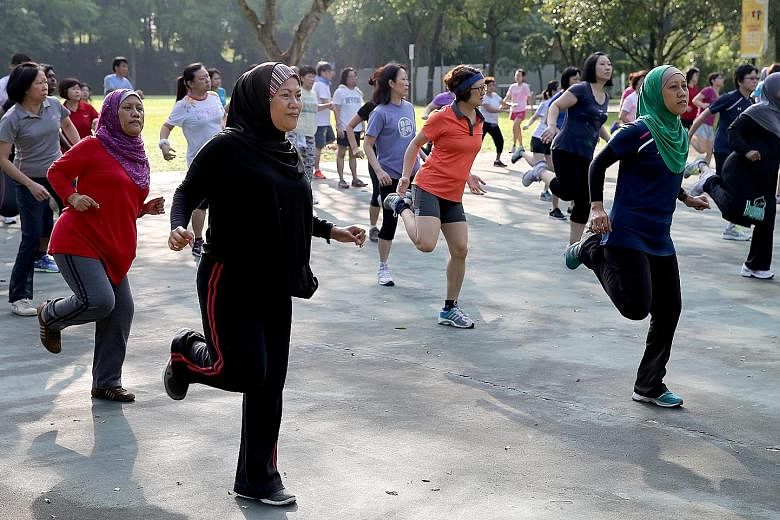 Residents participating in a Bokwa Fitness routine in Choa Chu Kang Park. The lack of physical activity remains a key health issue here as almost 40 per cent of Singaporeans do not get sufficient physical activity, according to the Health Promotion B