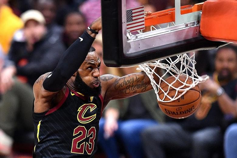 LeBron James dunking for the Cleveland Cavaliers during his side's loss to the Golden State Warriors in the NBA Finals last month. James will now be playing in the Western Conference, alongside the Warriors and the conference runners-up Houston Rocke