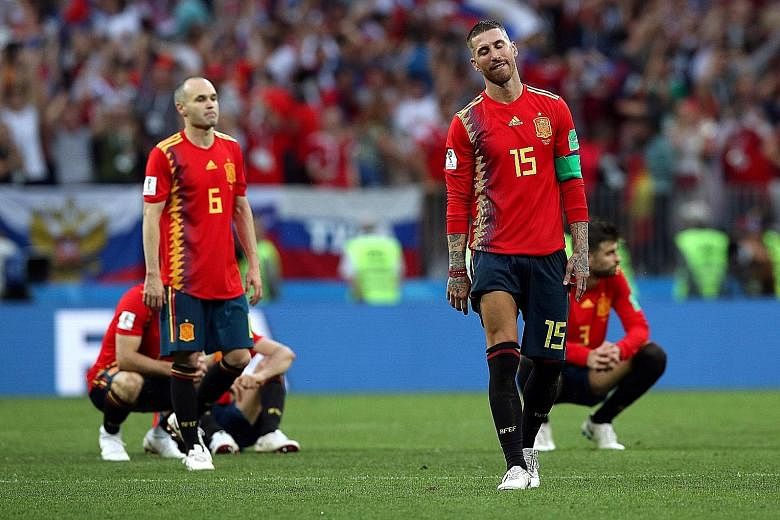 Captain Sergio Ramos and Andres Iniesta are crestfallen after Spain lose the penalty shoot-out to Russia at the Luzhniki Stadium in Moscow.