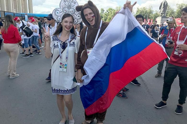Fans like this Russian couple were on a high after their country's improbable World Cup round-of-16 penalty shoot-out win over Spain.
