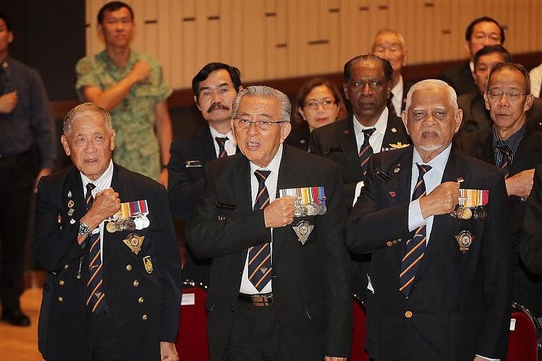 SAF veterans reciting the SAF Pledge during the SAF Day Combined Rededication Ceremony. There were four such ceremonies held around the island yesterday.
