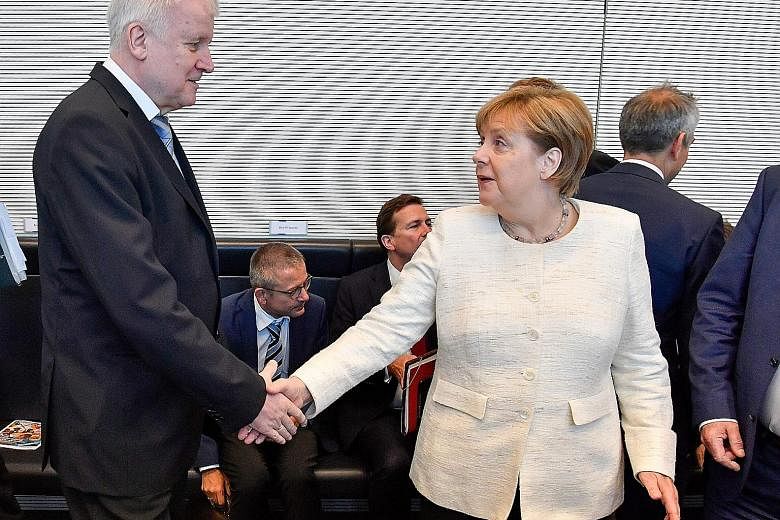 German Interior Minister Horst Seehofer and Chancellor Angela Merkel have agreed to tighten border controls and set up closed "transit centres" to allow the speedy processing of asylum seekers.