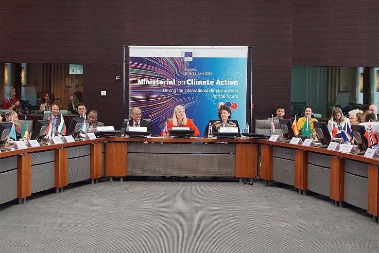 Minister for the Environment and Water Resources Masagos Zulkifli, seated with Canada's Minister of Environment and Climate Change Catherine McKenna (in red) at last month's Ministerial on Climate Action.