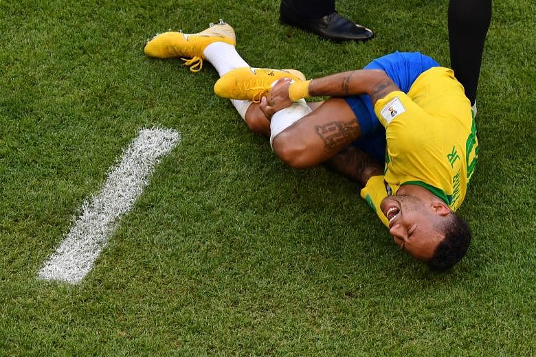 Clockwise, from above: Brazil forward Neymar after being tackled by Switzerland's Valon Behrami; sent tumbling by Costa Rica's Johnny Acosta; clutching his jaw after being fouled by Serbia's Dusan Tadic; after being stepped on by Mexico's Miguel Layu