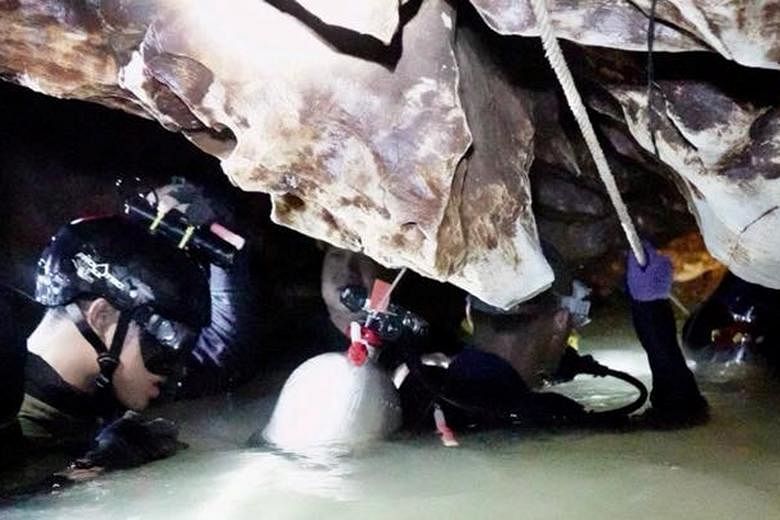 Divers from China helping with the rescue effort in the Tham Luang cave complex on Tuesday. The 12 boys and their football coach were found alive on Monday night.
