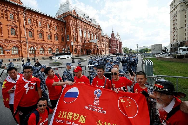 Chinese tourists visiting Moscow during the World Cup. Despite the world's most populous country failing to qualify for the tournament, their supporters have turned out in droves and are among the most numerous in Russia.