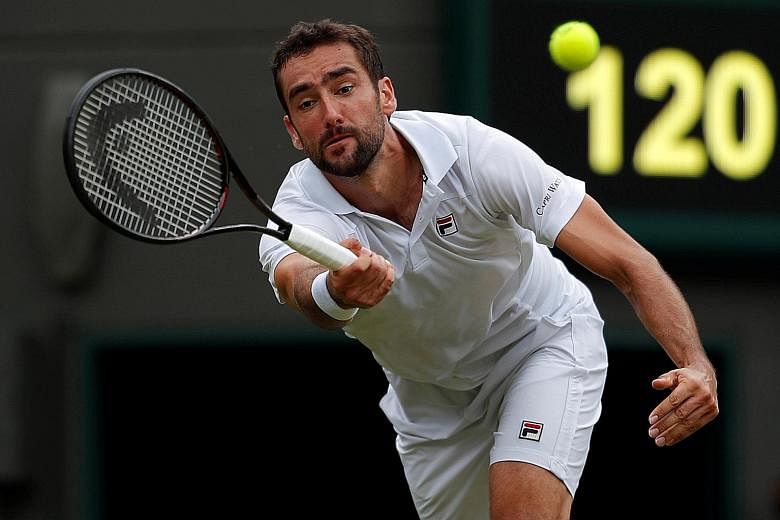 Croatia's Marin Cilic in action during his second-round match against Argentina's Guido Pella at Wimbledon yesterday, in which he suffered a shock 3-6, 1-6, 6-4, 7-6 (7-3), 7-5 defeat.