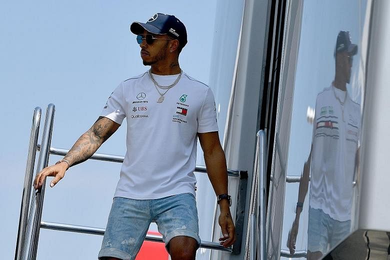 Lewis Hamilton at Silverstone circuit ahead of this weekend's British Grand Prix. In sweltering conditions, tyre management is crucial as he hunts for a fifth straight home win.