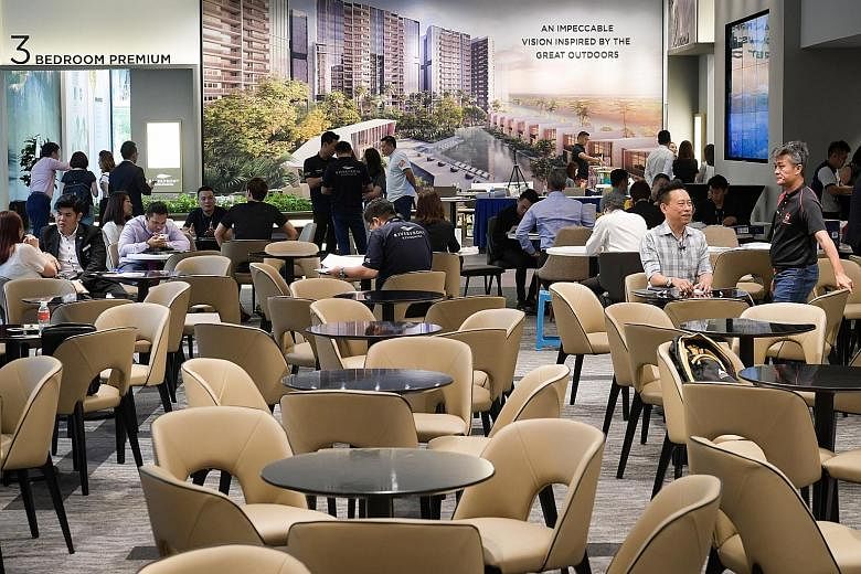 Riverfront Residences' showflat after the property cooling measures kicked in. The Hougang project's original launch date was this weekend, but it was brought forward to allow buyers to lock in deals. The crowd at the Riverfront Residences showflat b