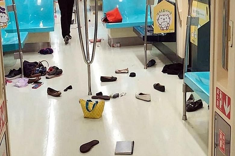 Belongings strewn on the floor of the train, left behind by commuters after they fled to another carriage when they spotted the rat.