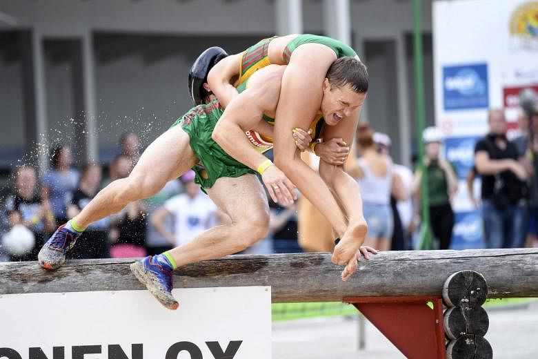 Lithuanian couple win world wifecarrying championship title in Finland