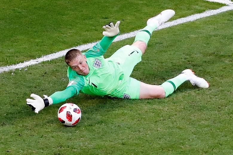 Top: Dele Alli putting England 2-0 up with a header. England goalkeeper Jordan Pickford contributing at the other end with one of his several saves to keep a first clean sheet in Russia.