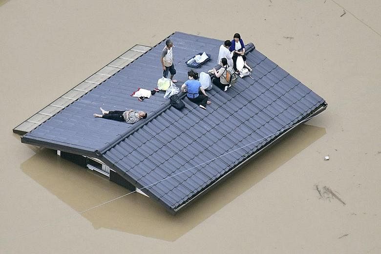 Pounding rain in Karatsu, Saga Prefecture, southwestern Japan, derailed a Japan Railways train. Japan's Meteorological Agency has issued special weather warnings urging vigilance against landslides, rising rivers and strong winds amid what it called 