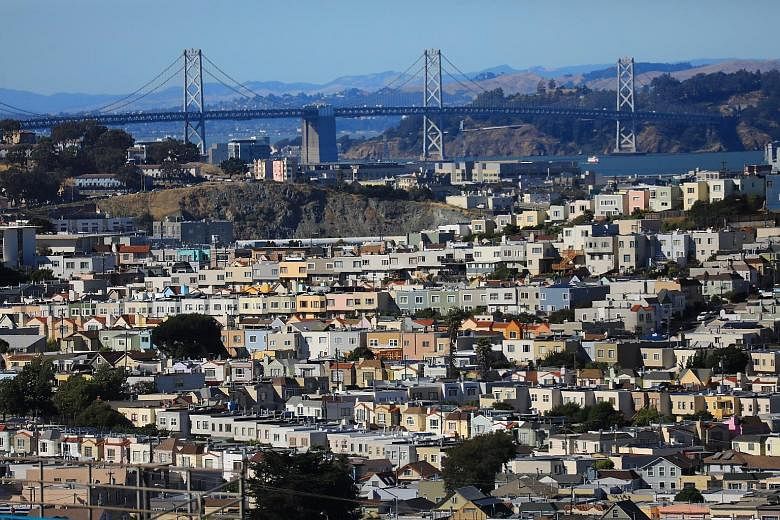 Houses near the Bay Bridge in picturesque, but prohibitively pricey, San Francisco. A family of four earning US$117,000 (S$158,800) is now classified as low income in the San Francisco area. This threshold, used to determine eligibility for federal h