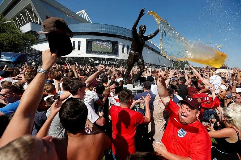 Clear weather prevails, but the forecast is for continuing beer showers as England fans celebrate outside Ashton Gate Stadium on Saturday.