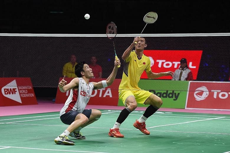 Japan's Kento Momota engaging China's Chen Long in some intricate net play at the Thomas Cup Finals in May. While Momota won the first singles, China roared back to take the title 3-1, showing that they are not in decline in the men's game despite ot