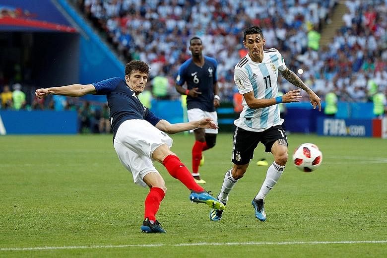 France defender Benjamin Pavard scoring in the 57th minute to make it 2-2 during the 4-3 victory against Argentina. His goal is widely regarded as one of the better strikes of the tournament so far. Below: Denis Cheryshev of Russia scores the opener 