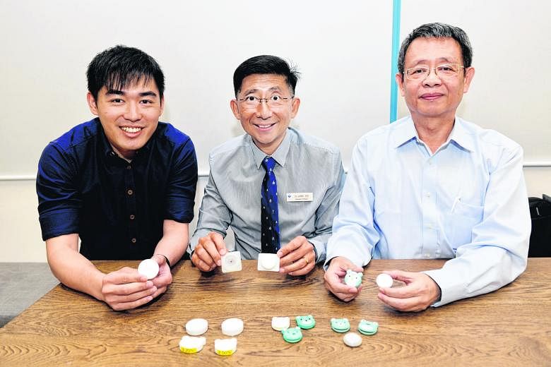 AEvice Health co-founders Adrian Ang and Ser Wee, and clinical adviser Daniel Goh (above). The firm's device can be stuck on a child's chest to track asthma symptoms and alerts parents to an asthma attack.