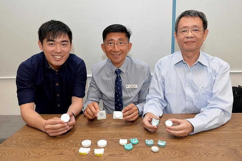 AEvice Health co-founders Adrian Ang and Ser Wee (above), and clinical adviser Daniel Goh. The firm's device can be stuck on a child's chest to track asthma symptoms and alerts parents to an asthma attack.