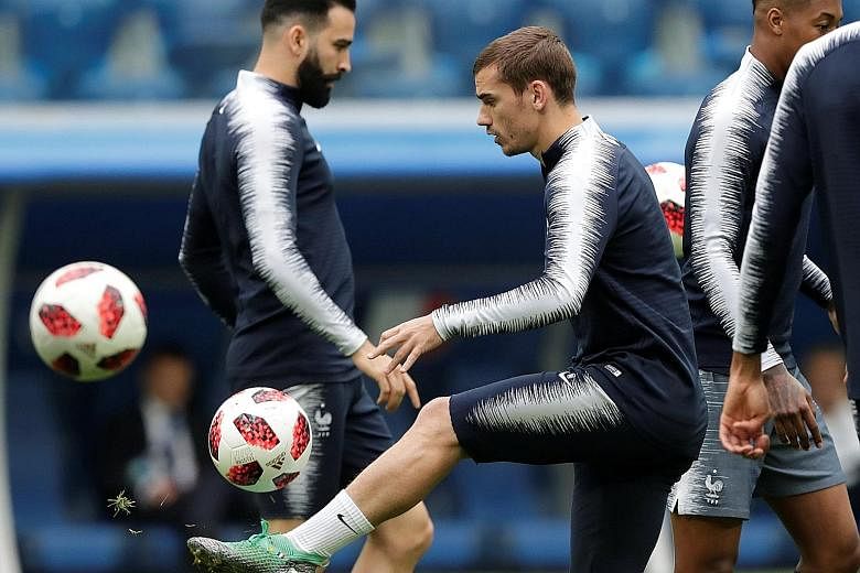 Forward Antoine Griezmann training with his team-mates ahead of today's semi-final clash with Belgium. France are aiming to reach their first final since 2006.