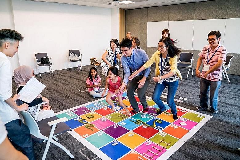 Above: Participants enjoying a life-sized board game designed for people to learn about mental wellness during A Good Day, an event organised by A Good Space. Left: Mr Dexter Tai, one of the changemakers who have benefited from A Good Space. With its