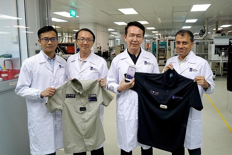 The team behind the smart shirt comprises (from left) Mr Justin Tan, Tex Line's product manager; Mr Lok Boon Keng, principal research engineer at SIMTech; Mr Rick Yeo, director of Emerging Applications Centre at SIMTech; and Mr Pawan Gandhi, CEO of K