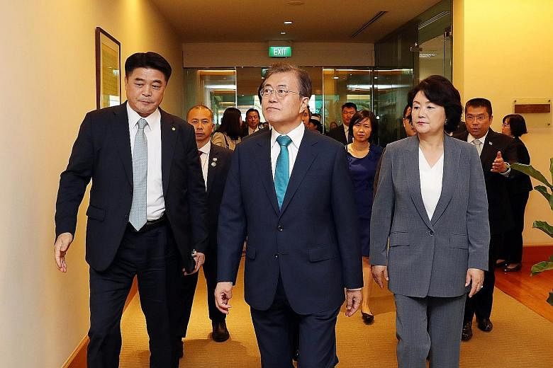 President Moon Jae-in and First Lady Kim Jung-sook arriving in Changi Airport yesterday for a state visit.
