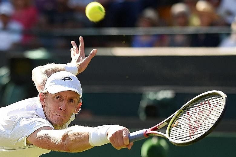 South African Kevin Anderson hitting a return against Roger Federer during his shock quarter-final win over the defending Wimbledon champion yesterday. He fought back from two sets down and even saved a match point in the third set.