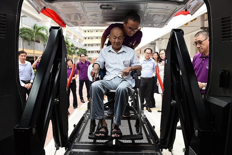 Mr Guek Chan Hong, 79, is the first to try the automatic hydraulic lifter on the refurbished Toyota HiAce bus donated to volunteer welfare organisation Blossom Seeds. In addition to the bus, ComfortDelGro has also donated $100,000 worth of medi trips