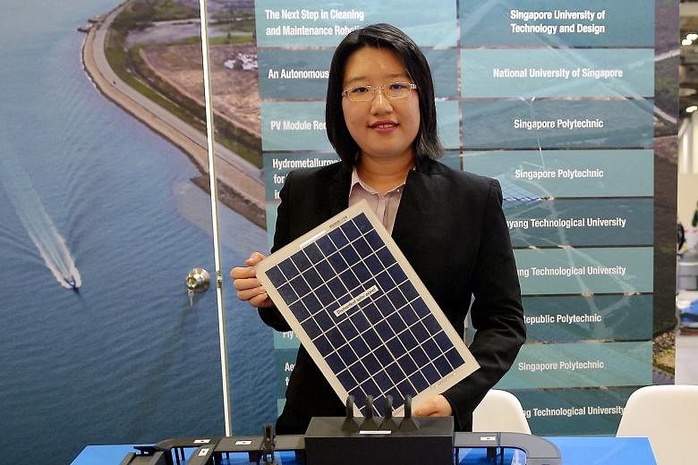 Dr Thong Ya Xuan with a model of a solar panel recycling plant. She says the Singapore Polytechnic team's method can recover almost all of a solar panel's materials.