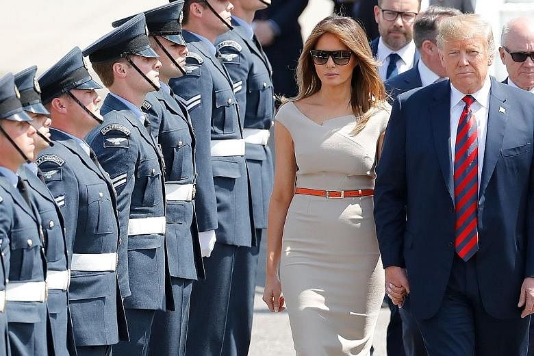 United States President Donald Trump and his wife, Melania, being greeted by an honour guard of Royal Air Force personnel after disembarking Air Force One at Stansted Airport. Many Britons were opposed to his visit, and police are expecting more than